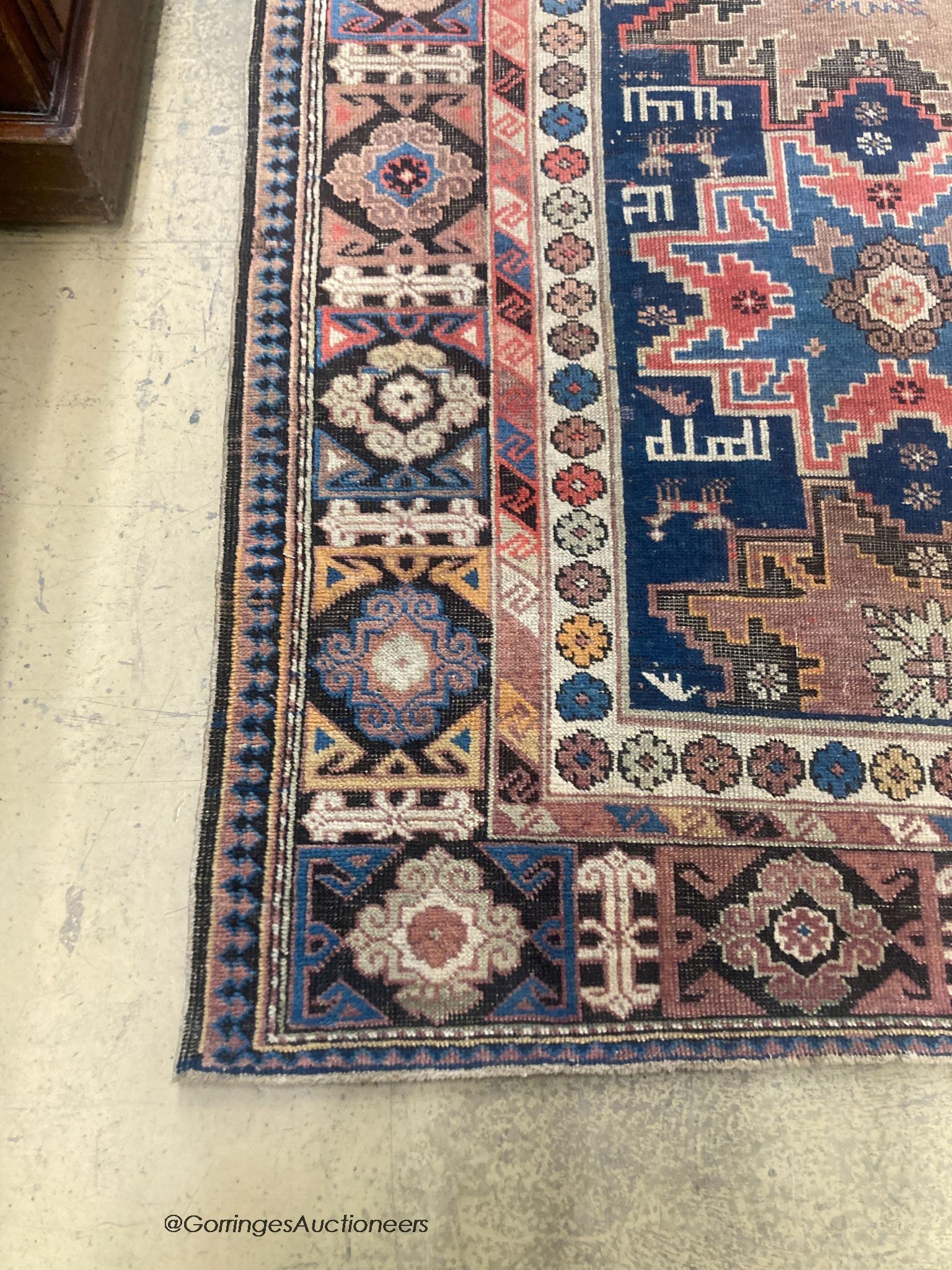 A Caucasian blue ground rug, 155 x 100cm